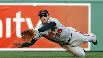 Apr 18, 2015; Boston, MA, USA; Baltimore Orioles first baseman Steve Pearce (28) makes a diving catch on Boston Red Sox shortstop Xander Bogaerts (2) during the fifth inning at Fenway Park. Mandatory Credit: Winslow Townson-USA TODAY Sports