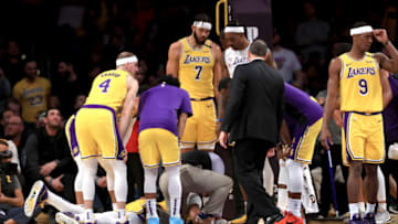 LOS ANGELES, CALIFORNIA - JANUARY 07: Alex Caruso #4, JaVale McGee #7, Rajon Rondo #9 and Dwight Howard #39 look on as Anthony Davis #3 of the Los Angeles Lakers lies on the ground after being injured contesting a shot by Julius Randle #30 of the New York Knicks look on during the second half of a game at Staples Center on January 07, 2020 in Los Angeles, California. NOTE TO USER: User expressly acknowledges and agrees that, by downloading and/or using this photograph, user is consenting to the terms and conditions of the Getty Images License Agreement (Photo by Sean M. Haffey/Getty Images)