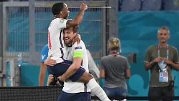 England's forward Harry Kane celebrates with England's forward Raheem Sterling (L) after scoring third goal during the UEFA EURO 2020 quarter-final football match between Ukraine and England at the Olympic Stadium in Rome on July 3, 2021. (Photo by ALBERTO LINGRIA / POOL / AFP) (Photo by ALBERTO LINGRIA/POOL/AFP via Getty Images)