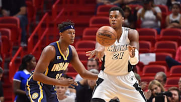 Dec 14, 2016; Miami, FL, USA; Miami Heat center Hassan Whiteside (21) passes the ball away from Indiana Pacers forward Georges Niang (32) during the first half at American Airlines Arena. Mandatory Credit: Jasen Vinlove-USA TODAY Sports