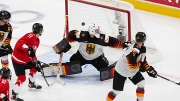 EDMONTON, AB - DECEMBER 26: Cole Perfetti #11 of Canada looks on as the puck flies past goaltender Jonas Gahr #30 of Germany during the 2021 IIHF World Junior Championship at Rogers Place on December 26, 2020 in Edmonton, Canada. (Photo by Codie McLachlan/Getty Images)