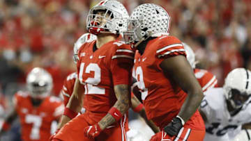 Ohio State Buckeyes safety Lathan Ransom (12) clebrates a sack of Penn State Nittany Lions quarterback Sean Clifford with defensive end Zach Harrison (9) during the second quarter of the NCAA football game at Ohio Stadium in Columbus on Saturday, Oct. 30, 2021.3 Penn State At Ohio State Football