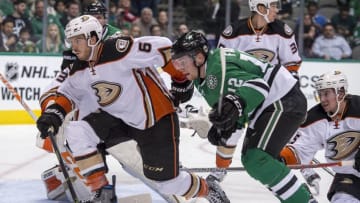 Oct 13, 2016; Dallas, TX, USA; Anaheim Ducks defenseman Simon Despres (6) and Dallas Stars center Radek Faksa (12) chase after the puck during the second period at the American Airlines Center. Mandatory Credit: Jerome Miron-USA TODAY Sports