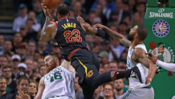 BOSTON, MA - MAY 27: Cleveland Cavaliers' LeBron James drives to the hoop as Boston Celtics Aron Baynes (left) and Marcus Morris (right) defend in the first house. The Boston Celtics hosted the Cleveland Cavaliers for Game Seven of their NBA Eastern Conference Finals playoff series at TD Garden in Boston on May 27, 2018. (Photo by Jim Davis/The Boston Globe via Getty Images)