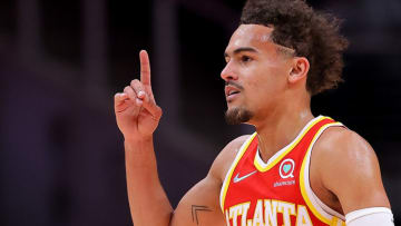 ATLANTA, GEORGIA - MARCH 13: Trae Young #11 of the Atlanta Hawks reacts after a three-point basket against the Indiana Pacers during the first half at State Farm Arena on March 13, 2022 in Atlanta, Georgia. NOTE TO USER: User expressly acknowledges and agrees that, by downloading and or using this photograph, User is consenting to the terms and conditions of the Getty Images License Agreement. (Photo by Kevin C. Cox/Getty Images)