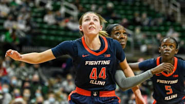 Illinois' Kendall Bostic, left, looks to rebound the ball as Michigan State's Tamara Farquhar defends during the first quarter on Thursday, Dec. 9, 2021, at the Breslin Center in East Lansing.211209 Msu Ill W Bball 039a