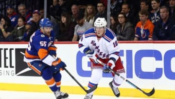 Dec 2, 2015; Brooklyn, NY, USA; New York Rangers center J.T. Miller (10) controls the puck against New York Islanders defenseman Johnny Boychuk (55) during the first period at Barclays Center. Mandatory Credit: Brad Penner-USA TODAY Sports