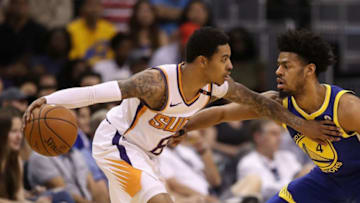 PHOENIX, AZ - APRIL 08: Tyler Ulis #8 of the Phoenix Suns handles the ball under pressure from Quinn Cook #4 of the Golden State Warriors during the first half of the NBA game at Talking Stick Resort Arena on April 8, 2018 in Phoenix, Arizona. NOTE TO USER: User expressly acknowledges and agrees that, by downloading and or using this photograph, User is consenting to the terms and conditions of the Getty Images License Agreement. (Photo by Christian Petersen/Getty Images)