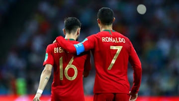 SOCHI, RUSSIA - JUNE 15: Cristiano Ronaldo of Portugal embraces team mate Bruno Fernandes during the 2018 FIFA World Cup Russia group B match between Portugal and Spain at Fisht Stadium on June 15, 2018 in Sochi, Russia. (Photo by Dean Mouhtaropoulos/Getty Images)