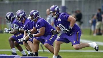 Jul 27, 2015; Mankato, MN, USA; Minnesota Vikings guard Joe Berger (61) and guard David Yankey (66) and tackle Carter Bykowski (60) run drills at training camp at Minnesota State University. Mandatory Credit: Bruce Kluckhohn-USA TODAY Sports