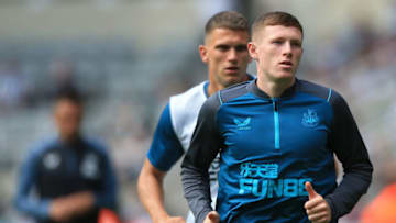 Elliot Anderson warms up for Newcastle United. (Photo by LINDSEY PARNABY/AFP via Getty Images)