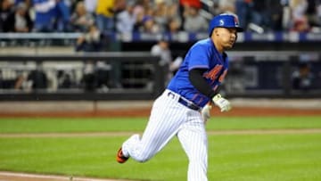 Sep 20, 2015; New York City, NY, USA; New York Mets shortstop Ruben Tejada (11) rounds first on his double to left during the first inning against the New York Yankeesat Citi Field. Mandatory Credit: Anthony Gruppuso-USA TODAY Sports