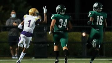 Male's Vinny Anthony holds up two fingers as he beats two Shamrock defenders while scoring on a 60-plus yard touchdown against Trinity Friday evening. Sept. 18, 2020Trinity Vs Male September 2020