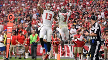Sep 18, 2016; Glendale, AZ, USA; Tampa Bay Buccaneers wide receiver Mike Evans (13) and quarterback Jameis Winston (3) celebrate a touchdown against the Arizona Cardinals during the second half at University of Phoenix Stadium. The Cardinals won 40-7. Mandatory Credit: Joe Camporeale-USA TODAY Sports
