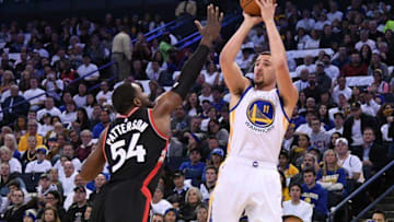December 28, 2016; Oakland, CA, USA; Golden State Warriors guard Klay Thompson (11) shoots the basketball against Toronto Raptors forward Patrick Patterson (54) during the third quarter at Oracle Arena. Mandatory Credit: Kyle Terada-USA TODAY Sports