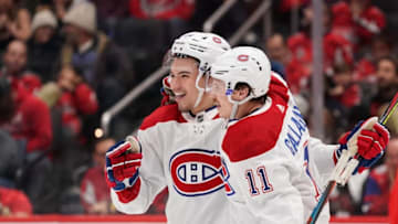 WASHINGTON, DC - NOVEMBER 15: Nick Suzuki #14 of the Montreal Canadiens celebrates with Brendan Gallagher #11 after scoring a goal in the second period against the Washington Capitals at Capital One Arena on November 15, 2019 in Washington, DC. (Photo by Patrick McDermott/NHLI via Getty Images)