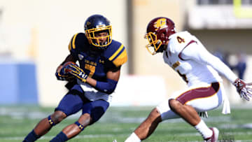 TOLEDO, OH - OCTOBER 22: Wide receiver Jon'Vea Johnson #7 of the Toledo Rockets looks to get away from defensive back Winslow Chapman #4 of the Central Michigan Chippewas at Glass Bowl on October 22, 2016 in Toledo, Ohio. (Photo by Andrew Weber/Getty Images)