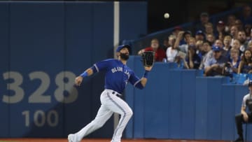 TORONTO, ON - SEPTEMBER 22: Jose Bautista #19 of the Toronto Blue Jays makes a running catch in the fourth inning during MLB game action against the New York Yankees at Rogers Centre on September 22, 2017 in Toronto, Canada. (Photo by Tom Szczerbowski/Getty Images)