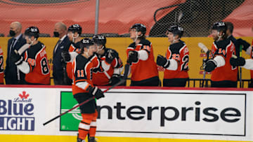 Apr 10, 2021; Philadelphia, Pennsylvania, USA; Philadelphia Flyers right wing Travis Konecny (11) celebrates with teammates after scoring a goal against the Boston Bruins in the first period at the Wells Fargo Center. Mandatory Credit: Mitchell Leff-USA TODAY Sports