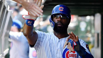 CHICAGO, ILLINOIS - AUGUST 22: Jason Heyward #22 of the Chicago Cubs celebrates in the dugout with teammates after scoring in the fourth inning against the San Francisco Giants at Wrigley Field on August 22, 2019 in Chicago, Illinois. (Photo by Quinn Harris/Getty Images)