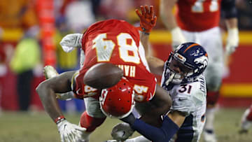 Dec 25, 2016; Kansas City, MO, USA; Denver Broncos free safety Justin Simmons (31) breaks up a pass intended for Kansas City Chiefs tight end Demetrius Harris (84) during the second half at Arrowhead Stadium. The Chiefs won 33-10. Mandatory Credit: Jay Biggerstaff-USA TODAY Sports