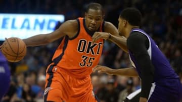 Dec 6, 2015; Oklahoma City, OK, USA; Oklahoma City Thunder forward Kevin Durant (35) drives to the basket against Sacramento Kings forward Rudy Gay (8) during the fourth quarter at Chesapeake Energy Arena. Mandatory Credit: Mark D. Smith-USA TODAY Sports