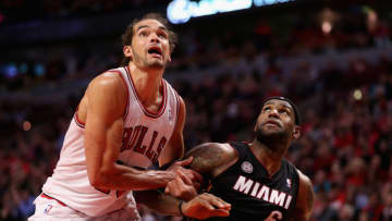 CHICAGO, IL - MAY 10: Joakim Noah #13 of the Chicago Bulls and LeBron James #6 the Miami Heat battle for rebound position in Game Three of the Eastern Conference Semifinals during the 2013 NBA Playoffs at the United Center on May 10, 2013 in Chicago, Illinois. The Heat defeated the Bulls 104-94. NOTE TO USER: User expressly acknowledges and agrees that, by downloading and or using this photograph, User is consenting to the terms and conditions of the Getty Images License Agreement. (Photo by Jonathan Daniel/Getty Images)