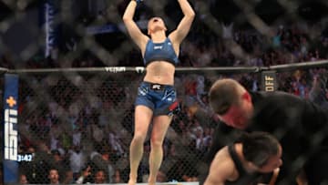 JACKSONVILLE, FL - APRIL 24: Rose Namajunas of the United States celebrates after beating Zhang Weili of China during the Women's Strawweight Title bout of UFC 261 at VyStar Veterans Memorial Arena on April 24, 2021 in Jacksonville, Florida. (Photo by Alex Menendez/Getty Images)