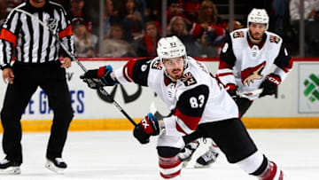 NEWARK,NJ - OCTOBER 25: Conor Garland #83 of the Arizona Coyotes plays the puck against the New Jersey Devils during the game at the Prudential Center on October 25, 2019 in Newark, New Jersey. (Photo by Andy Marlin/NHLI via Getty Images)