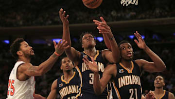 Dec 20, 2016; New York, NY, USA; Indiana Pacers center Myles Turner (33) and forward Thaddeus Young (21) battle for a rebound with New York Knicks guard Derrick Rose (25) during the second half at Madison Square Garden. Mandatory Credit: Adam Hunger-USA TODAY Sports