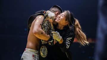 Angela Lee embraces her brother Christian Lee following his title win at ONE: Enter the Dragon in Singapore (Photo by ONE Championship)