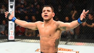 WINNIPEG, CANADA - DECEMBER 16: Rafael Dos Anjos of Brazil raises his hands after facing Robbie Lawler in their welterweight bout during the UFC Fight Night event at Bell MTS Place on December 16, 2017 in Winnipeg, Manitoba, Canada. (Photo by Josh Hedges/Zuffa LLC/Zuffa LLC via Getty Images)