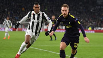 TURIN, ITALY - FEBRUARY 13: Christian Eriksen of Tottenham Hotspur is challenged by Alex Sandro of Juventus during the UEFA Champions League Round of 16 First Leg match between Juventus and Tottenham Hotspur at Allianz Stadium on February 13, 2018 in Turin, Italy. (Photo by Michael Regan/Getty Images)