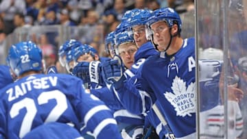 TORONTO, ON - OCTOBER 9: The Toronto Maple Leafs bench congratulates Nikita Zaitsev