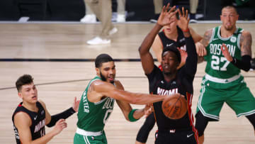 LAKE BUENA VISTA, FLORIDA - SEPTEMBER 23: Jayson Tatum #0 of the Boston Celtics looks to pass against Tyler Herro #14 of the Miami Heat during the fourth quarter in Game Four of the Eastern Conference Finals during the 2020 NBA Playoffs at AdventHealth Arena at the ESPN Wide World Of Sports Complex on September 23, 2020 in Lake Buena Vista, Florida. NOTE TO USER: User expressly acknowledges and agrees that, by downloading and or using this photograph, User is consenting to the terms and conditions of the Getty Images License Agreement. (Photo by Kevin C. Cox/Getty Images)