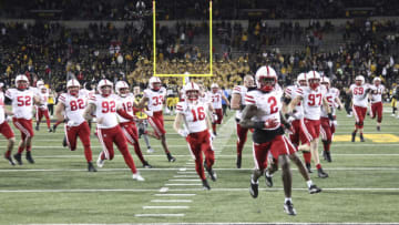 The Nebraska Cornhuskers rush the field (Photo by Matthew Holst/Getty Images)
