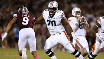 Auburn footballSTARKVILLE, MS - OCTOBER 06: Calvin Ashley #70 of the Auburn Tigers guards as Montez Sweat #9 of the Mississippi State Bulldogs rushes during a game at Davis Wade Stadium on October 6, 2018 in Starkville, Mississippi. (Photo by Jonathan Bachman/Getty Images)