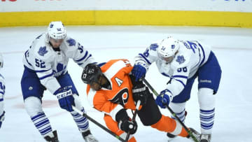 Apr 7, 2016; Philadelphia, PA, USA; Philadelphia Flyers right wing Wayne Simmonds (17) is checked by Toronto Maple Leafs defenseman Martin Marincin (52) and left wing Colin Greening (38) during the third period at Wells Fargo Center. The Leafs defeated the Flyers, 4-3 in overtime. Mandatory Credit: Eric Hartline-USA TODAY Sports