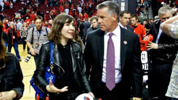 May 10, 2014; Portland, OR, USA; Portland Trail Blazers general manager Neil Olshey (R) talks to actress Carrie Brownstein of Portlandia (L) after game three of the second round of the 2014 NBA Playoffs between the Portland Trail Blazers and San Antonio Spurs at the Moda Center. Mandatory Credit: Craig Mitchelldyer-USA TODAY Sports