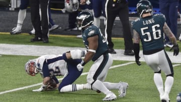 MINNEAPOLIS, MN - FEBRUARY 04: Tom Brady #12 of the New England Patriots gets tackled by Brandon Graham #55 of the Philadelphia Eagles during Super Bowl LII at U.S. Bank Stadium on February 4, 2018 in Minneapolis, Minnesota. The Eagles defeated the Patriots 41-33. (Photo by Focus on Sport/Getty Images) *** Local Caption *** Tom Brady; Brandon Graham