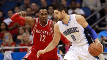 Dec 23, 2015; Orlando, FL, USA; Orlando Magic center Nikola Vucevic (9) drives to the basket as Houston Rockets center Dwight Howard (12) defends during the first quarter at Amway Center. Mandatory Credit: Kim Klement-USA TODAY Sports