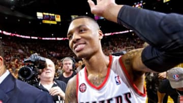 May 2, 2014; Portland, OR, USA; Portland Trail Blazers guard Damian Lillard (0) walks off the court after hitting the game winning shot against the Houston Rockets during the fourth quarter in game six of the first round of the 2014 NBA Playoffs at the Moda Center. Mandatory Credit: Craig Mitchelldyer-USA TODAY Sports
