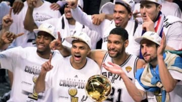 Jun 15, 2014; San Antonio, TX, USA; San Antonio Spurs forward Kawhi Leonard (2), guard Tony Parker (9), forward Tim Duncan (21) and guard Manu Ginobili (20) celebrate with the Larry O