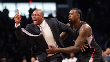 Nov 29, 2016; Brooklyn, NY, USA; Los Angeles Clippers head coach Doc Rivers is restrained by Los Angeles Clippers center DeAndre Jordan (6) as he argues with referee Ken Mauer (not pictured) after receiving a technical foul during the first overtime quarter against the Brooklyn Nets at Barclays Center. Rivers then received a second technical foul and was ejected from the game. Mandatory Credit: Brad Penner-USA TODAY Sports