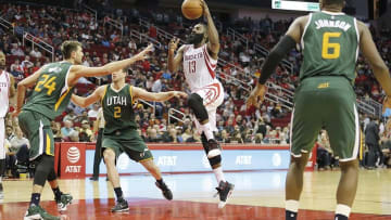 Nov 19, 2016; Houston, TX, USA; Houston Rockets guard James Harden (13) drives to the basket against Utah Jazz center Jeff Withey (24) and forward Joe Ingles (2) in the second half at Toyota Center. Rockets won 111-102. Mandatory Credit: Thomas B. Shea-USA TODAY Sports