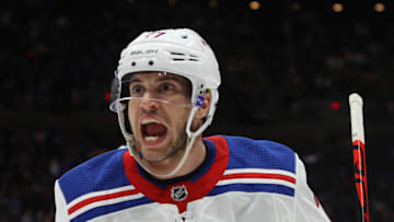 NEW YORK, NEW YORK - FEBRUARY Tony DeAngelo #77 of the New York Rangers celebrates a first period goal by Artemi Panarin #10 against the New York Islanders at NYCB Live's Nassau Coliseum on February 25, 2020 in Uniondale, New York. (Photo by Bruce Bennett/Getty Images)