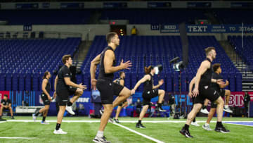 Tight end prospects warm up during the 2022 NFL Combine (Photo by Kevin Sabitus/Getty Images)