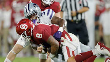 Kansas State's Desmond Purnell (32) brings down Oklahoma's Dillon Gabriel (8) during a college football game between the University of Oklahoma Sooners (OU) and the Kansas State Wildcats at Gaylord Family - Oklahoma Memorial Stadium in Norman, Okla., Saturday, Sept. 24, 2022. Kansas State won 41-34.Ou Vs Kansas State