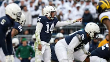 Nov 13, 2021; University Park, Pennsylvania, USA; Penn State Nittany Lions quarterback Sean Clifford (14) gestures from the line of scrimmage during the fourth quarter against the Michigan Wolverines at Beaver Stadium. Michigan defeated Penn State 21-17. Mandatory Credit: Matthew OHaren-USA TODAY Sports