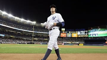 Sep 24, 2013; Bronx, NY, USA; New York Yankees third baseman Alex Rodriguez walks back to the dugout after flying out to end the fourth inning against the Tampa Bay Rays at Yankee Stadium. Mandatory Credit: John Munson/THE STAR-LEDGER via USA TODAY Sports